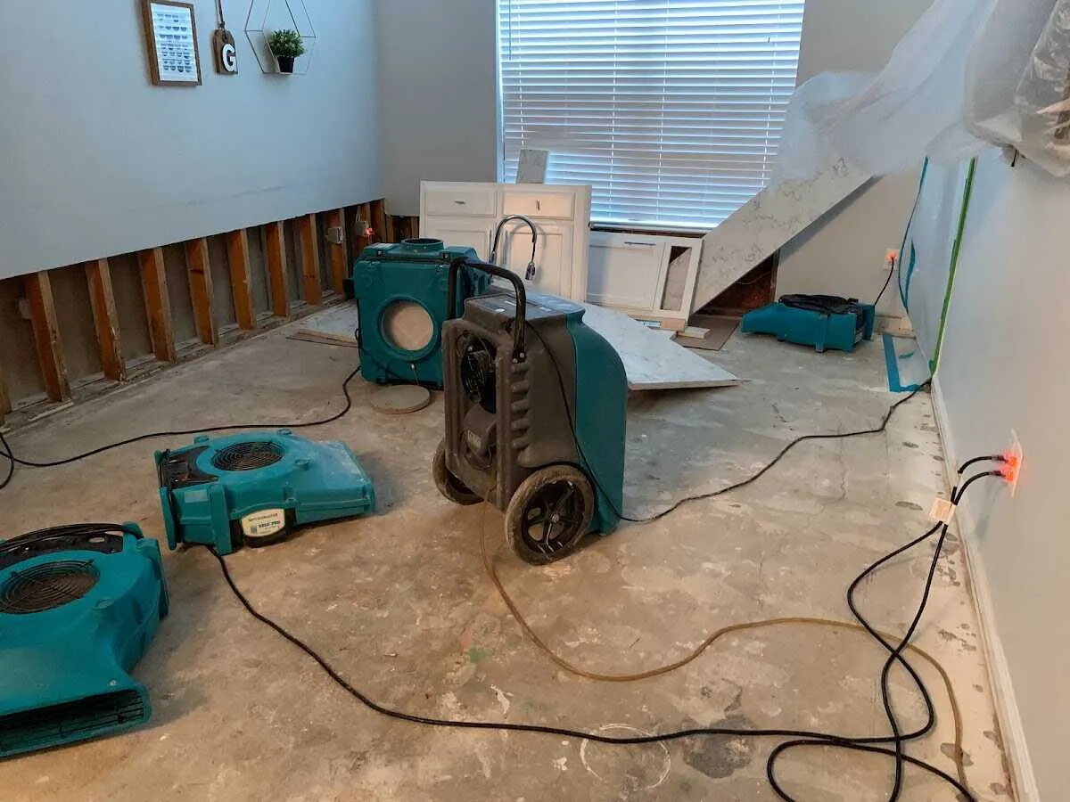 Dehumidifier in flood-cut room for Water Damage Restoration in Opp